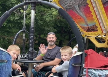 Dad with two boys on LOMB Tornado ride 
